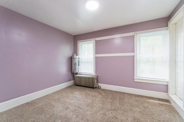 266 Laurel Rd, Lehighton, PA 18235 - unfurnished room featuring radiator heating unit, carpet flooring, and healthy amount of natural light