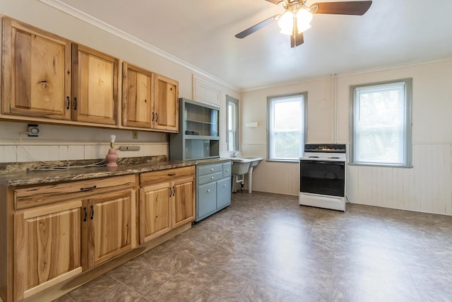 266 Laurel Rd, Lehighton, PA 18235 - kitchen with white range with electric cooktop, ceiling fan, a wainscoted wall, crown molding, and a desk