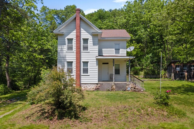 266 Laurel Rd, Lehighton, PA 18235 - view of front of house with covered porch, a chimney, and a front yard