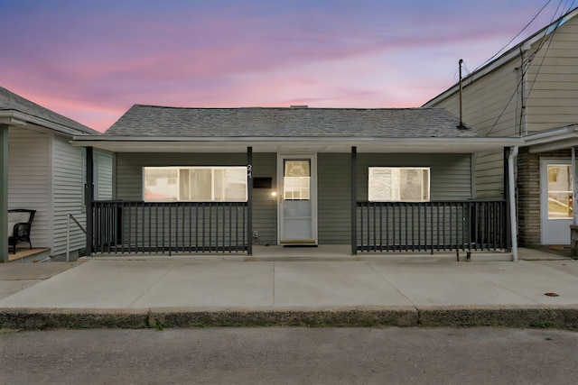 24 W Garibaldi Ave, Nesquehoning, PA 18240 - view of front facade featuring a porch and a shingled roof