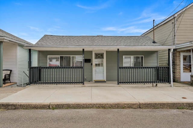 24 W Garibaldi Ave, Nesquehoning, PA 18240 - view of front of house featuring a shingled roof and covered porch