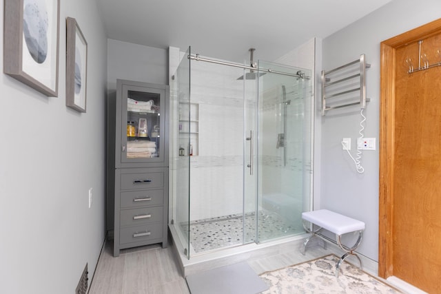 bathroom featuring a shower stall