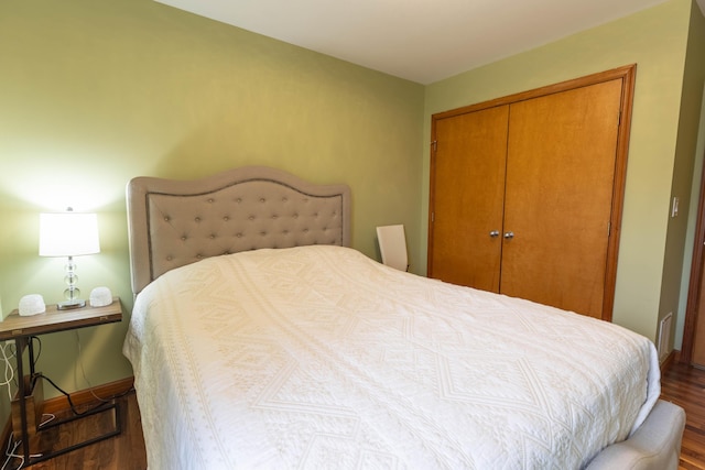 bedroom featuring a closet and wood finished floors