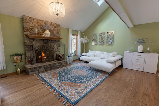 living room featuring high vaulted ceiling, a stone fireplace, wood finished floors, and visible vents