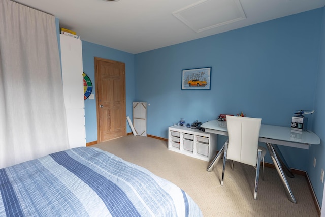 carpeted bedroom with attic access and baseboards