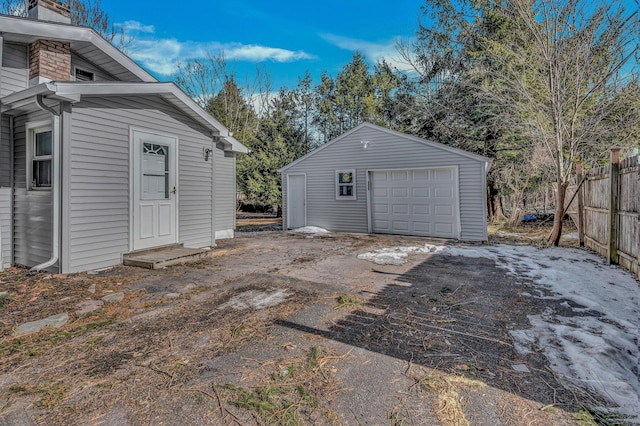 exterior space featuring driveway and fence