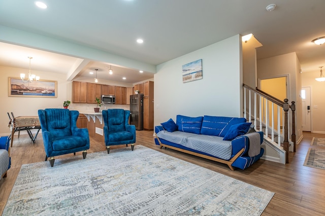 320 Bendelow Ln, Northampton, PA 18067 - living room featuring wood finished floors, a chandelier, stairway, and recessed lighting