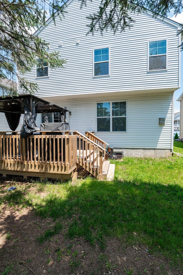 320 Bendelow Ln, Northampton, PA 18067 - rear view of house with a deck, a lawn, and an AC wall unit