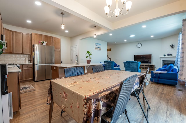 320 Bendelow Ln, Northampton, PA 18067 - dining area with light wood-type flooring, recessed lighting, a chandelier, stairway, and beam ceiling