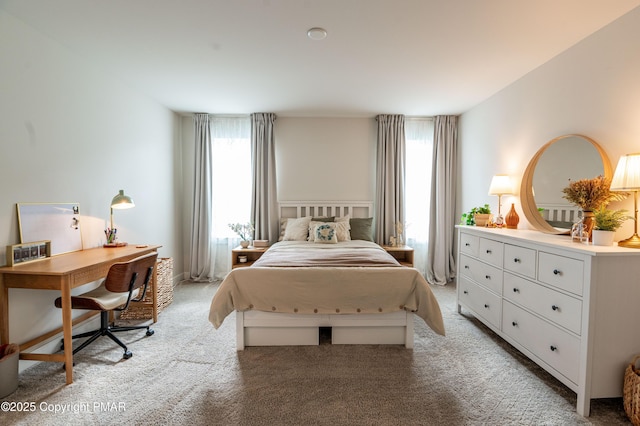 bedroom featuring light carpet