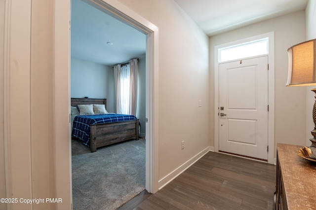 foyer with dark hardwood / wood-style floors