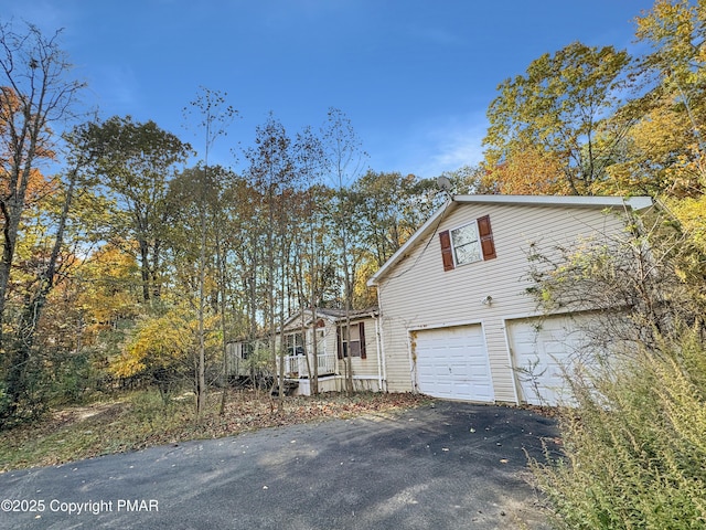 228 Victory Ln, Stroudsburg, PA 18360 - view of side of property with driveway and a garage