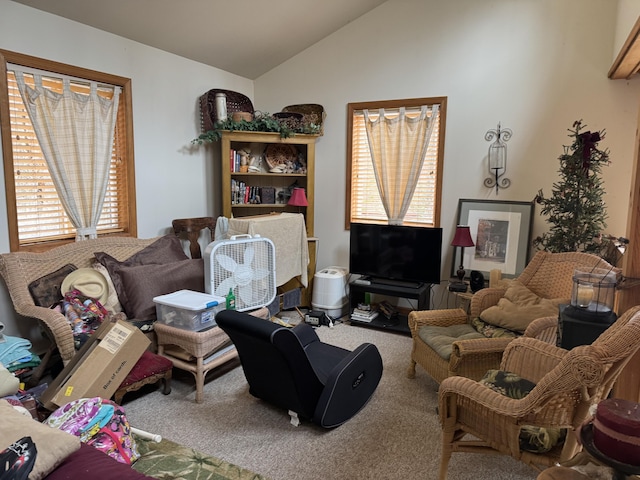 carpeted living room with vaulted ceiling