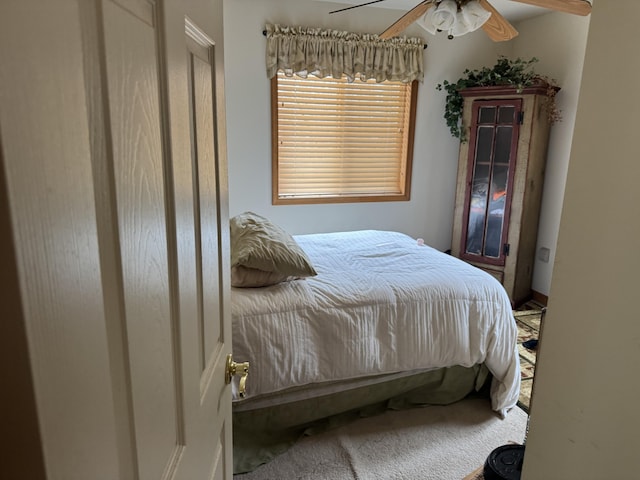 carpeted bedroom featuring a ceiling fan