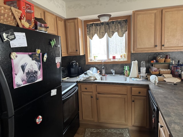 kitchen with a sink, decorative backsplash, dark countertops, and black appliances