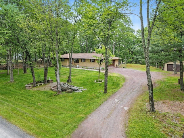 3106 Janet St, East Stroudsburg, PA 18301 - ranch-style house with driveway, a front lawn, a garage, and a chimney