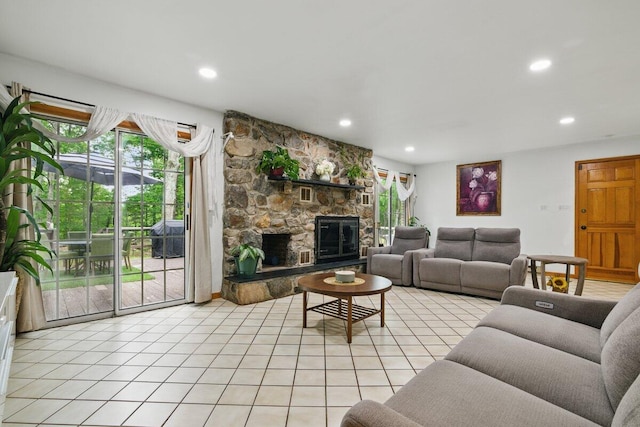 3106 Janet St, East Stroudsburg, PA 18301 - living room featuring light tile patterned floors, a stone fireplace, and recessed lighting