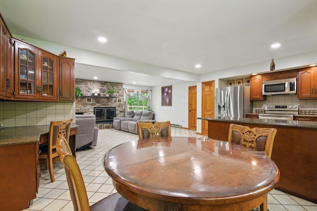 3106 Janet St, East Stroudsburg, PA 18301 - dining space featuring light tile patterned flooring and a fireplace