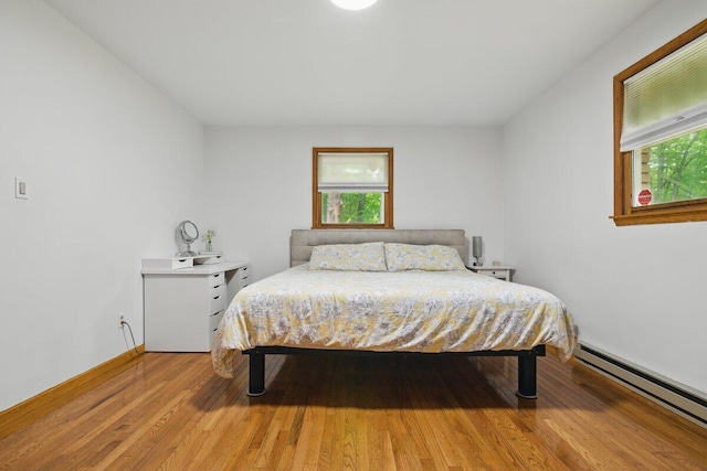 3106 Janet St, East Stroudsburg, PA 18301 - bedroom featuring multiple windows, light wood finished floors, and baseboard heating