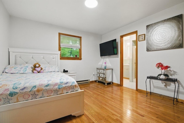 3106 Janet St, East Stroudsburg, PA 18301 - bedroom featuring baseboard heating, light wood-type flooring, baseboards, and ensuite bath