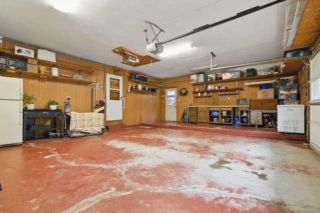 3106 Janet St, East Stroudsburg, PA 18301 - garage featuring freestanding refrigerator and a garage door opener