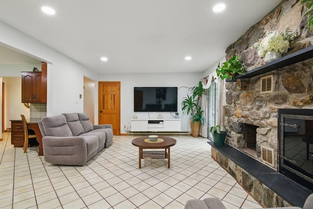 3106 Janet St, East Stroudsburg, PA 18301 - living room featuring light tile patterned floors, a stone fireplace, and recessed lighting