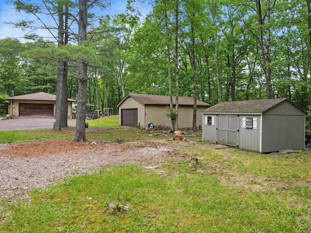 3106 Janet St, East Stroudsburg, PA 18301 - view of yard featuring a garage, an outdoor structure, and view of scattered trees