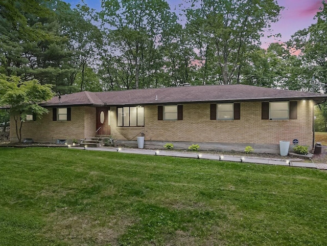 3106 Janet St, East Stroudsburg, PA 18301 - single story home featuring brick siding, a lawn, and view of wooded area