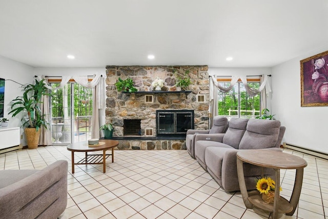 3106 Janet St, East Stroudsburg, PA 18301 - living area featuring a baseboard heating unit, light tile patterned floors, a stone fireplace, and recessed lighting