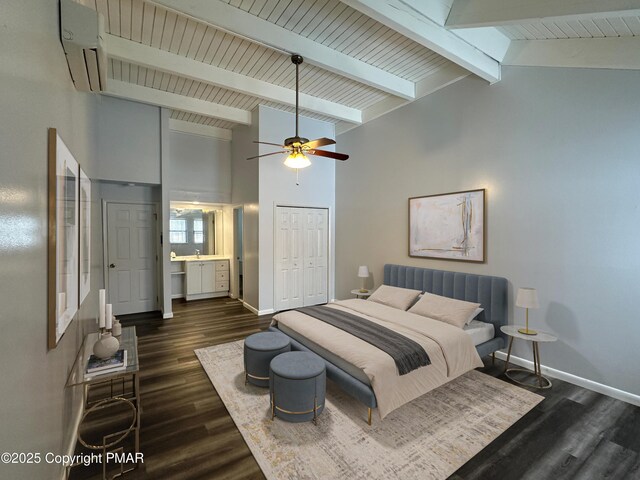 bedroom featuring a closet, baseboards, and dark wood-type flooring