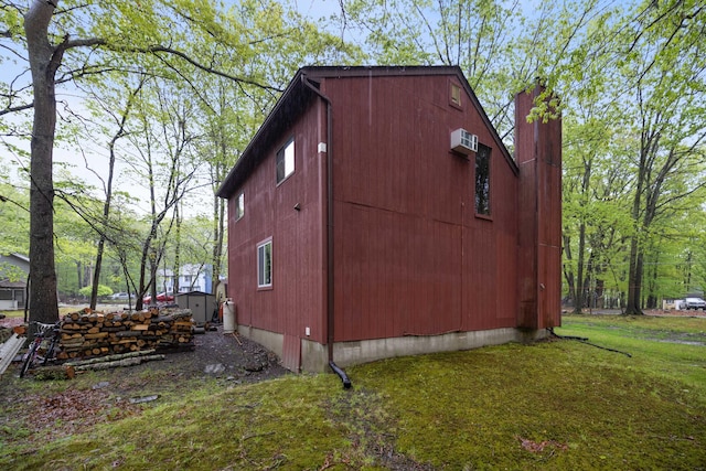 235 Scenic Dr, East Stroudsburg, PA 18302 - view of property exterior with an outdoor structure, a chimney, a yard, and a storage unit