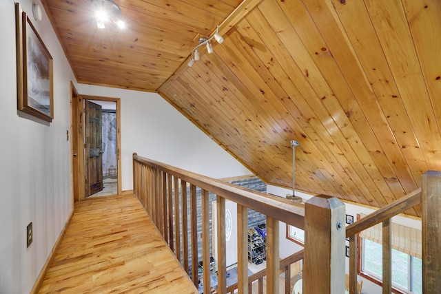 235 Scenic Dr, East Stroudsburg, PA 18302 - hallway with baseboards, wood finished floors, wood ceiling, an upstairs landing, and track lighting