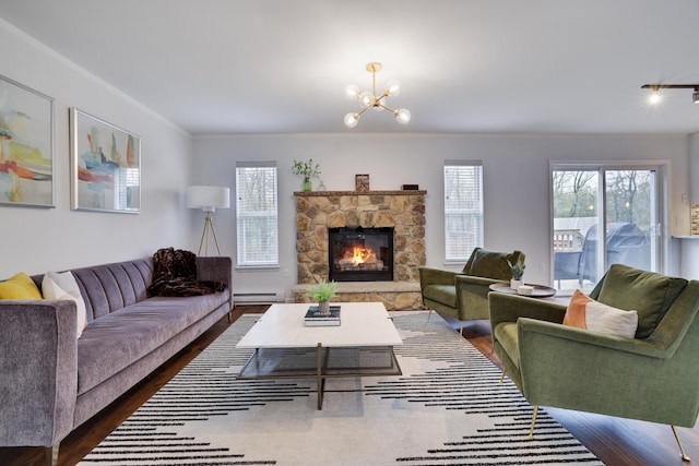 5175 White Birch Dr, Long Pond, PA 18334 - living area with dark wood-type flooring, a baseboard heating unit, plenty of natural light, and ornamental molding