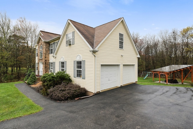 5175 White Birch Dr, Long Pond, PA 18334 - view of property exterior featuring a garage, asphalt driveway, cooling unit, and roof with shingles