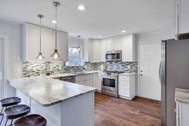 5175 White Birch Dr, Long Pond, PA 18334 - kitchen featuring appliances with stainless steel finishes, a peninsula, a sink, white cabinets, and dark wood-type flooring