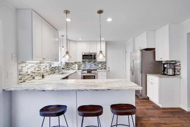 5175 White Birch Dr, Long Pond, PA 18334 - kitchen featuring stainless steel appliances, a sink, a peninsula, decorative backsplash, and recessed lighting