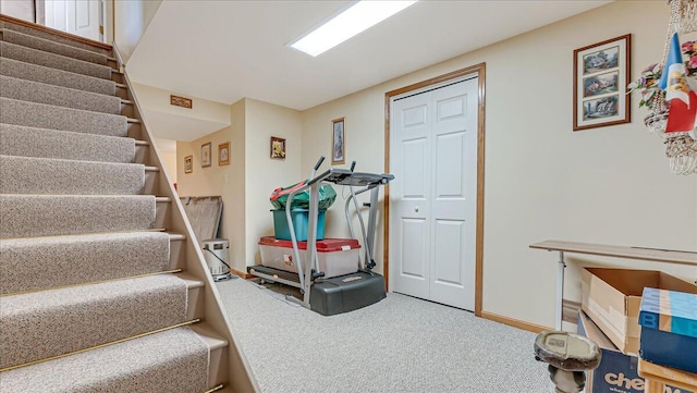 interior space with baseboards and carpet flooring