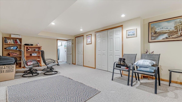 exercise area with recessed lighting, light colored carpet, and baseboards