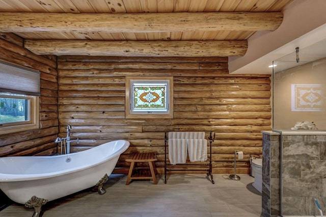 full bath with wooden ceiling, a freestanding tub, toilet, beamed ceiling, and wood finished floors