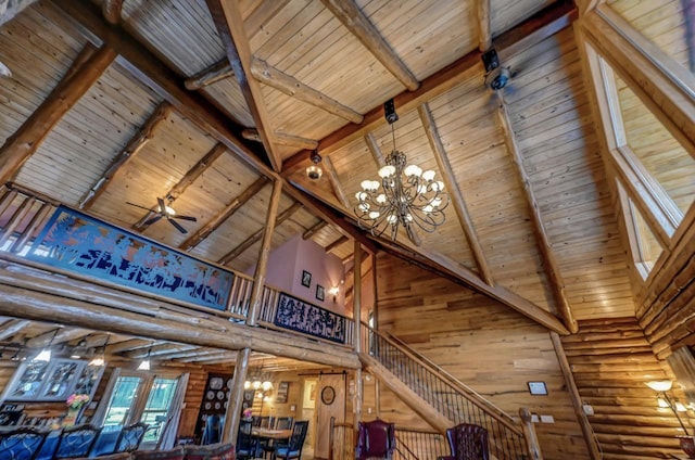 interior space featuring wooden ceiling, high vaulted ceiling, and a notable chandelier