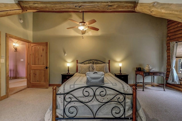 carpeted bedroom with baseboards, vaulted ceiling with beams, and a ceiling fan