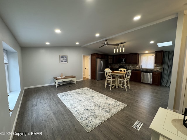 dining space featuring lofted ceiling, recessed lighting, dark wood-type flooring, visible vents, and baseboards