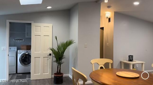 dining space featuring dark wood-style floors, washing machine and dryer, vaulted ceiling with skylight, and recessed lighting