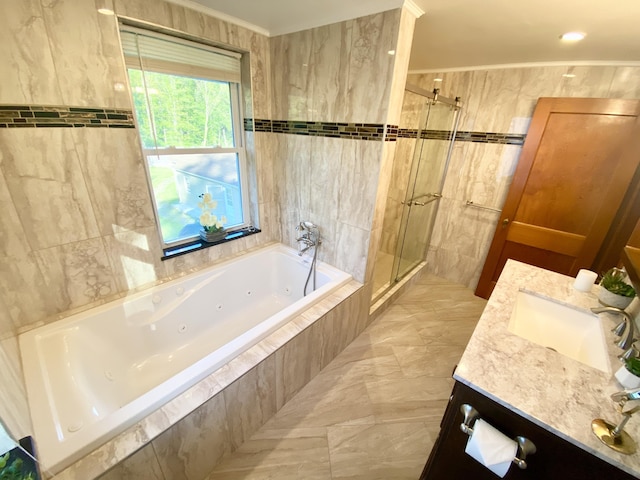 244 Learn Rd, Tannersville, PA 18372 - full bathroom featuring a shower stall, tile walls, vanity, a tub with jets, and ornamental molding