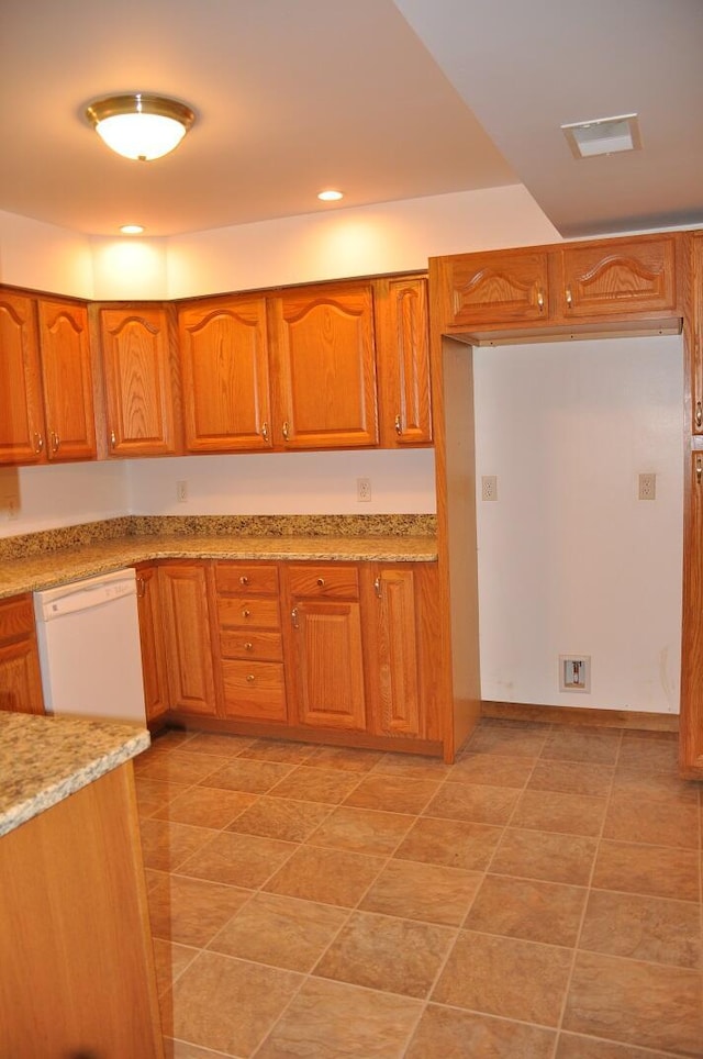 kitchen with visible vents, brown cabinets, light stone counters, recessed lighting, and dishwasher