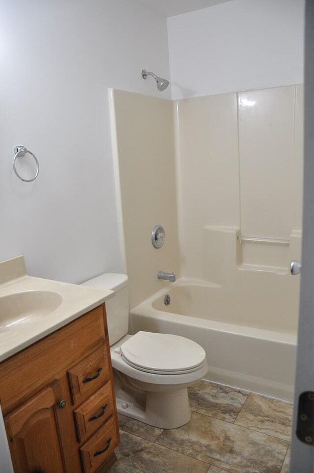 full bath featuring vanity, toilet, and shower / bathtub combination