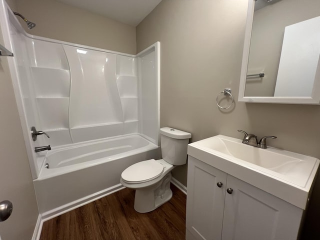 full bath with vanity, bathing tub / shower combination, toilet, and wood finished floors