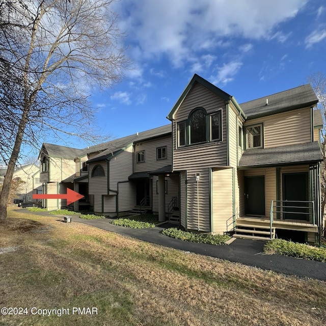 back of property featuring a porch