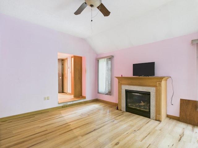 114 Oswayo Dr, Pocono Lake, PA 18347 - unfurnished living room with wood finished floors, a ceiling fan, lofted ceiling, a fireplace, and baseboards