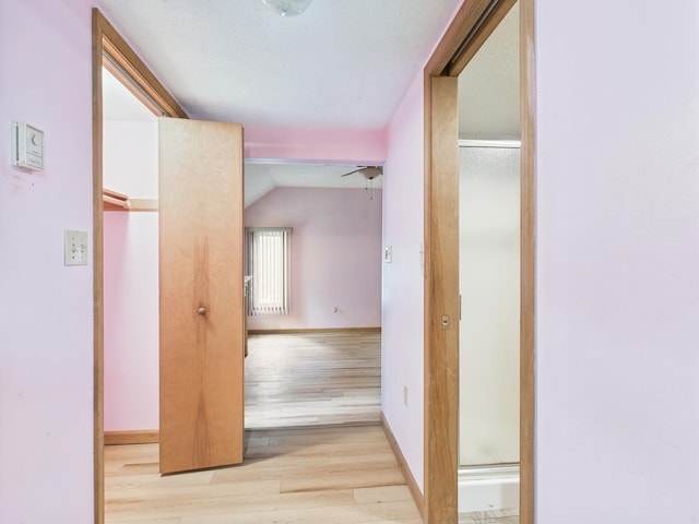 114 Oswayo Dr, Pocono Lake, PA 18347 - corridor featuring wood finished floors, lofted ceiling, and baseboards